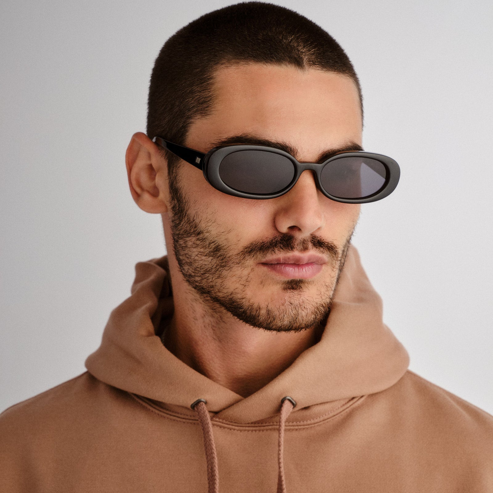 Outta Love + Black Uni-Sex Oval Sunglasses | Le Specs