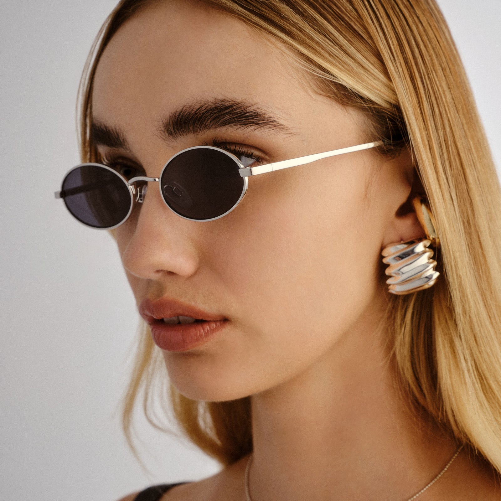 Love Train Silver Female Oval Sunglasses | Le Specs