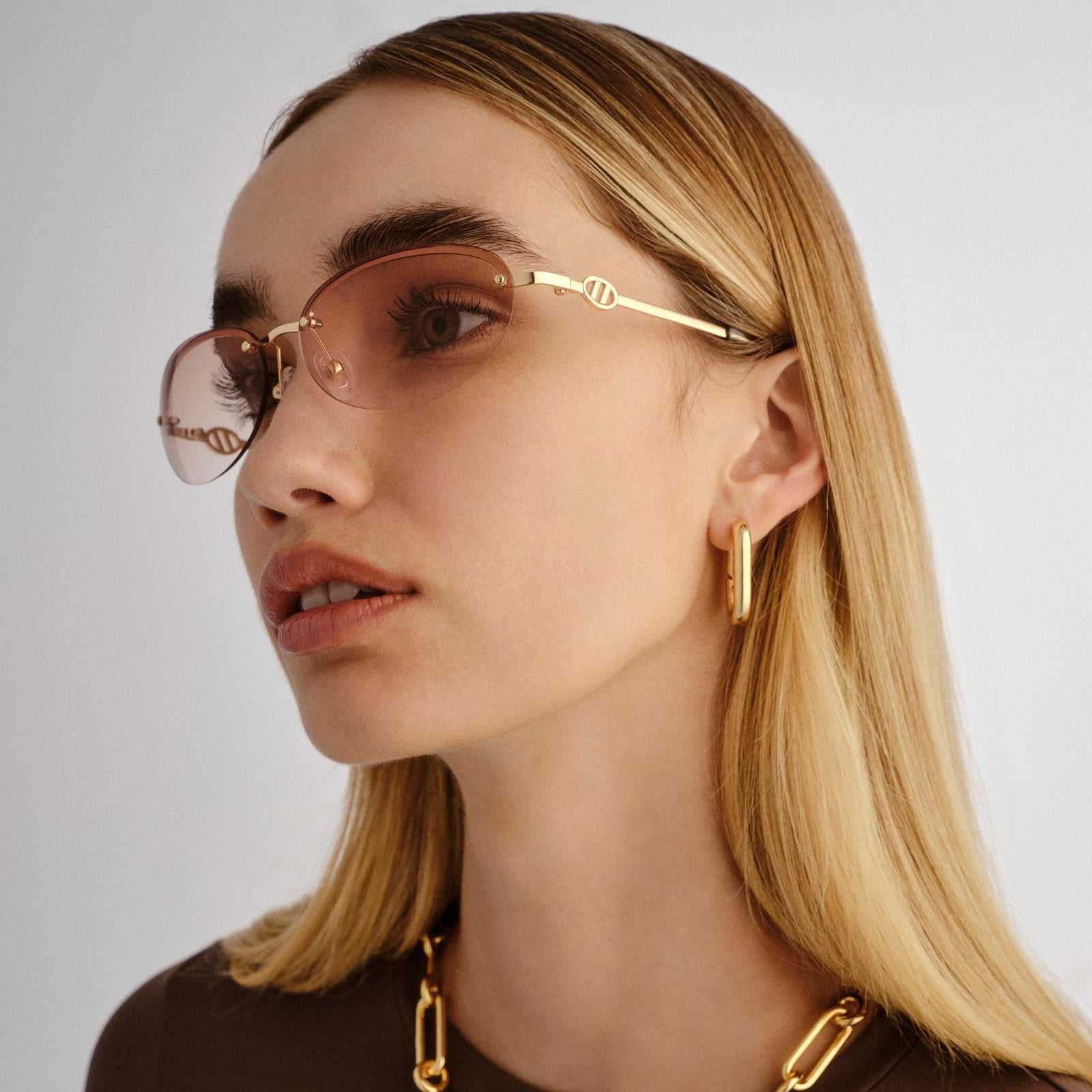 Slinky Gold Female Oval Sunglasses | Le Specs
