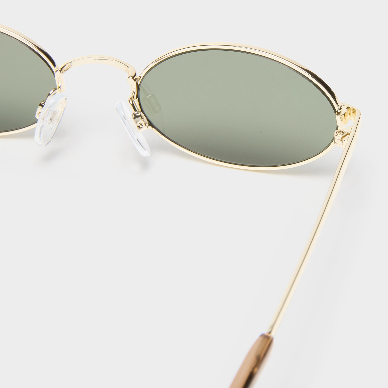 Love Train Bright Gold Female Oval Sunglasses | Le Specs