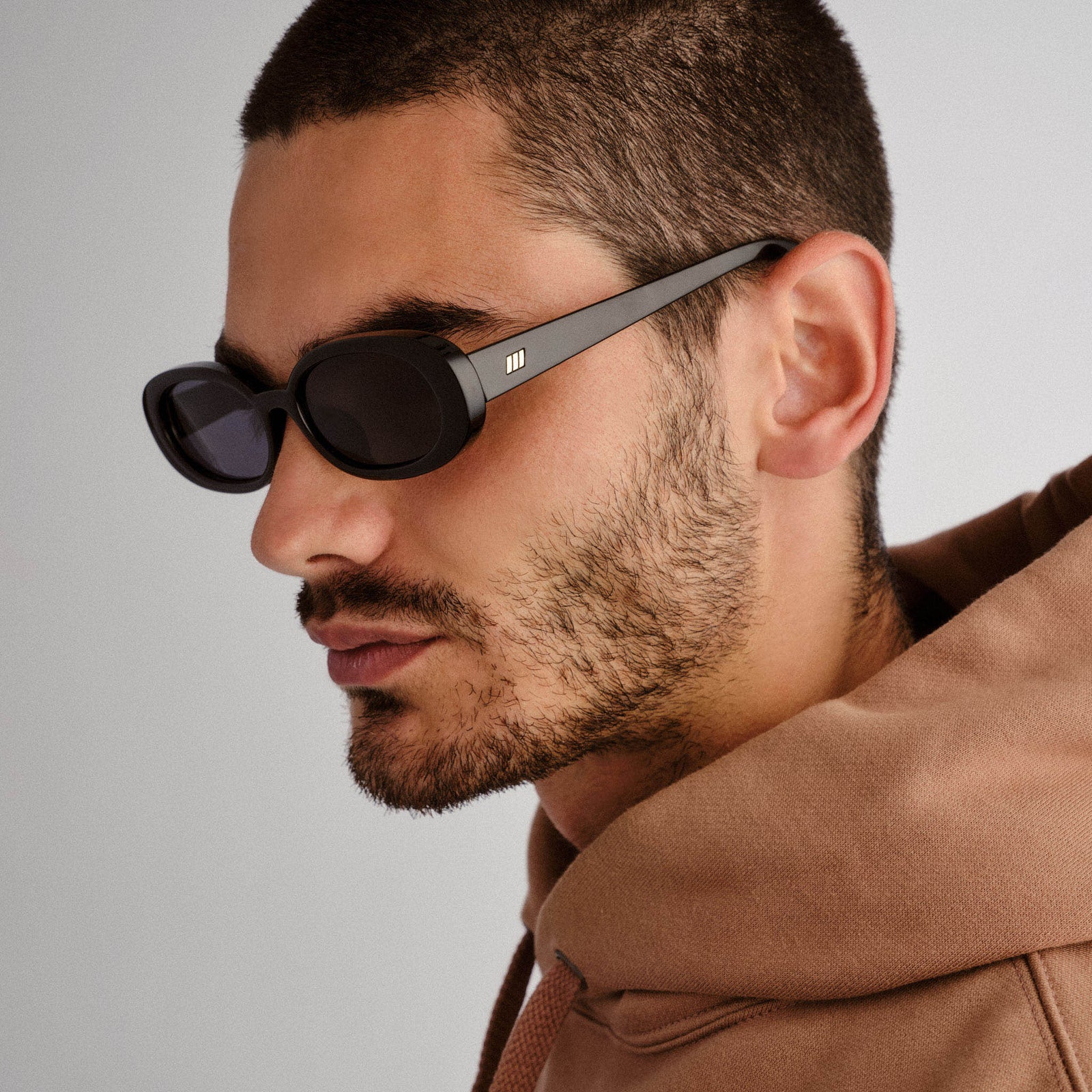 Outta Love + Black Uni-Sex Oval Sunglasses | Le Specs