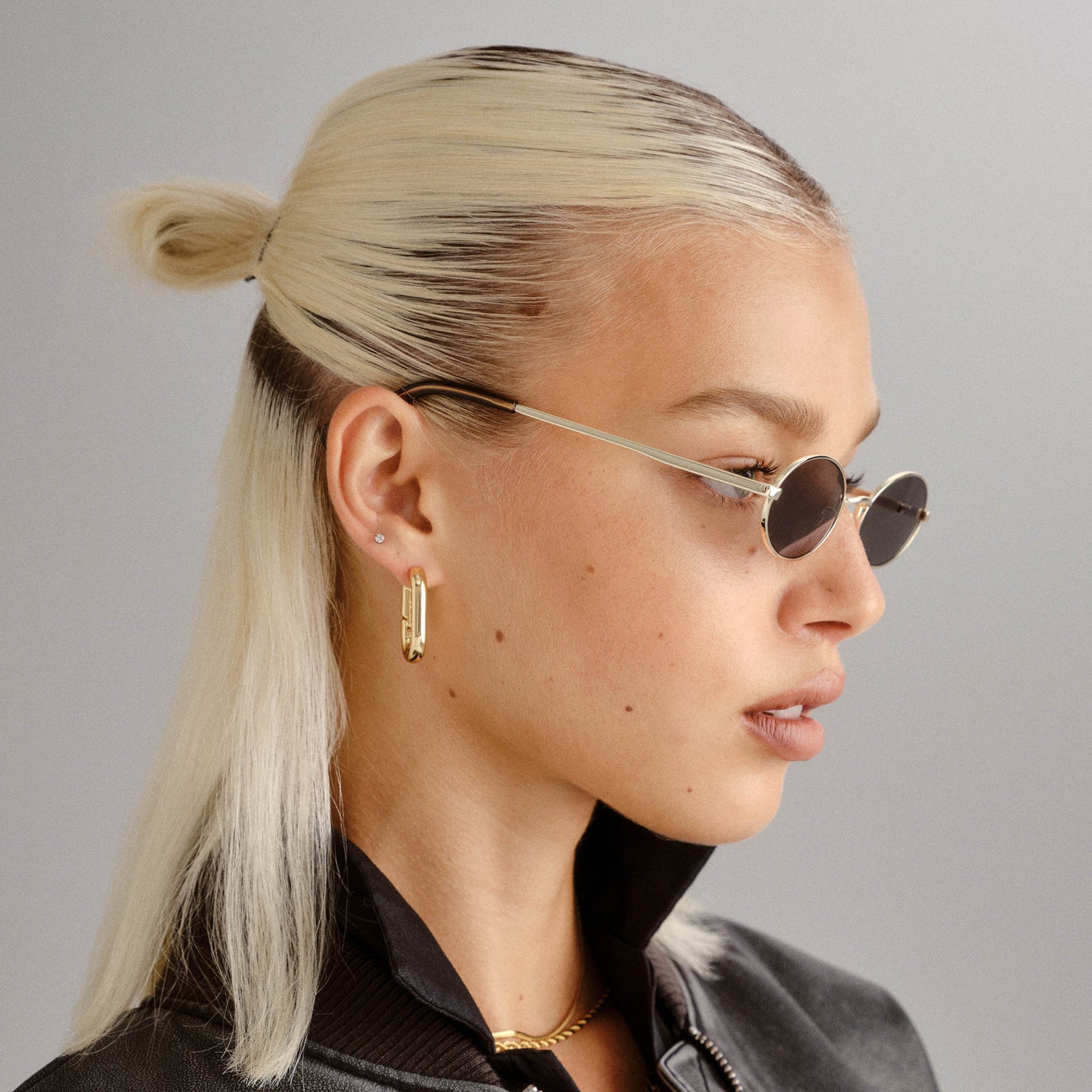 Love Train Bright Gold Female Oval Sunglasses | Le Specs